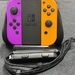 Nintendo Switch Nintendo Switch Joy-Cons Pair HAC-015/HAC-016 Neon Purple/Neon Orange And Grip