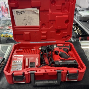 Tools 2607-20 Milwaukee Hammer Drill SN:F25CR243100752 with battery, charger & 